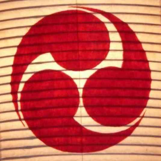 Your Japan Private Tours' logo, a symbol of the Tao.