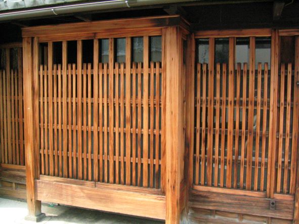 The well cleaned and loved front of a downtown Kyoto machiya that stretches back to hidden worlds.